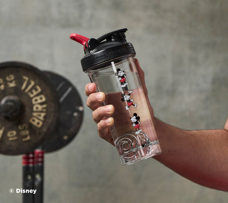 pro-series-t9 Mickey_Mouse_Protein_Shaker_Bottle_Being_Held_In_the_Gym.jpg